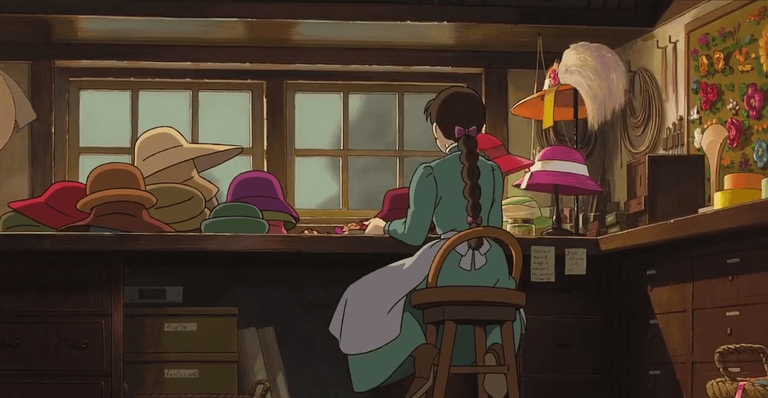 Sophie Hatter making hats in her family's shop while looking out the window