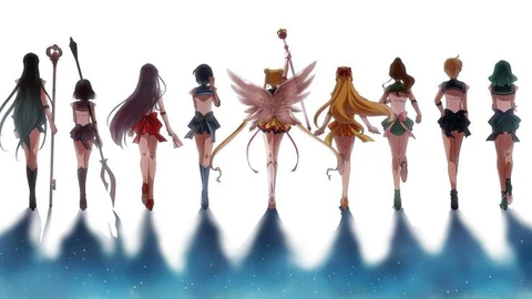 Sailor Guardians walking forward with weapons illuminated by light