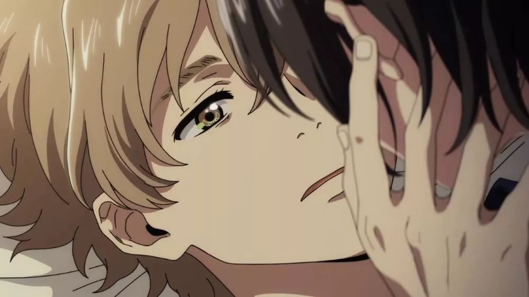 A close-up shot of Shun and Mio sharing an intimate moment in the anime movie 'The Stranger by the Shore'