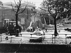 A car bombing scene showing the destructive violence that follows broken mafia codes