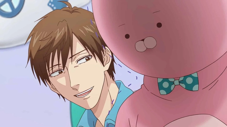 Uramichi with a jaded smile next to the pink rabbit mascot