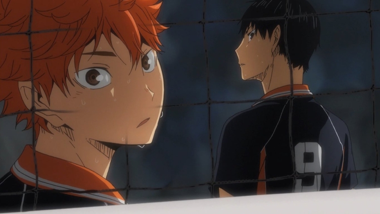 Shoyo Hinata and Tobio Kageyama looking on intensely during a match