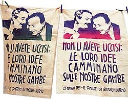Protest banners showing loyalty to the dead which mirrors Avilio's dedication to his murdered family