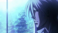 Shogo Makishima gazes out a window in contemplation