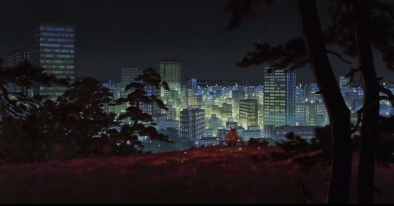 A lone figure sits on a hill overlooking a modern city skyline at night in a scene from Grave of the Fireflies, symbolizing historical legacies.